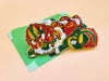 A Sushi Tomodachi " Monster Roll " Design Pin